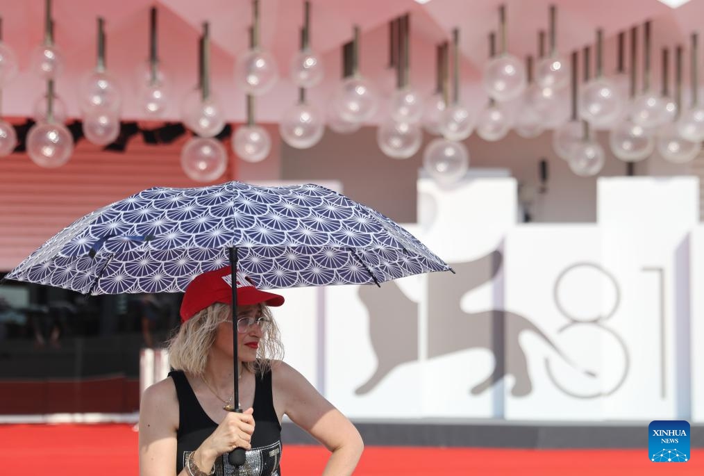 A woman is seen in front of the Palazzo del Cinema on Lido Island, in Venice, Italy, Aug. 28, 2024. The 81st Venice Film Festival will run from Aug. 28 until Sept. 7 at the Venice Lido island. (Photo: Xinhua)