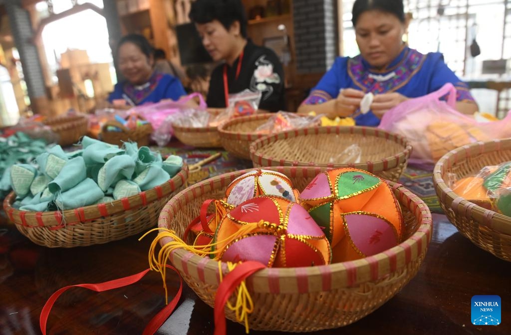 Locals make embroidered balls in Xinjing Township of Jingxi City, south China's Guangxi Zhuang Autonomous Region, Aug. 27, 2024. Embroidered balls from Jingxi are well received nationwide due to their exquisite design and craftsmanship, which are uaually stuffed with spices or herbal medicines. (Photo: Xinhua)