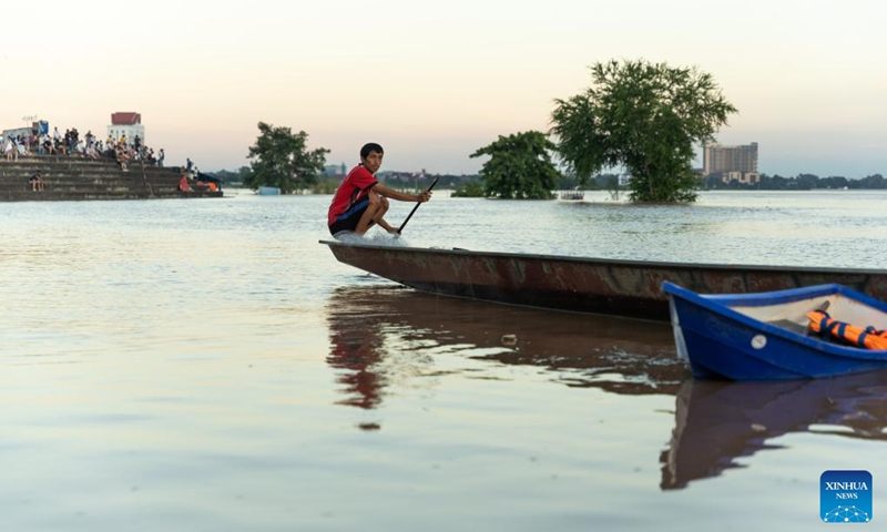 This photo taken on Aug. 27, 2024 shows a villager fishing on Mekong River in Vientiane, capital of Laos. The water level of the Mekong has risen after continuous rainfall during rainy season in Laos. (Photo: Xinhua)