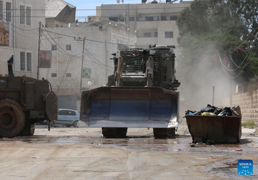 Israeli military vehicles are seen during an Israeli operation in the northern West Bank city of Jenin, on Aug. 28, 2024. At least 10 Palestinians were killed on Wednesday by Israeli shelling and gunfire in the northern West Bank, according to the Ramallah-based Palestinian Health Ministry. (Photo: Xinhua)