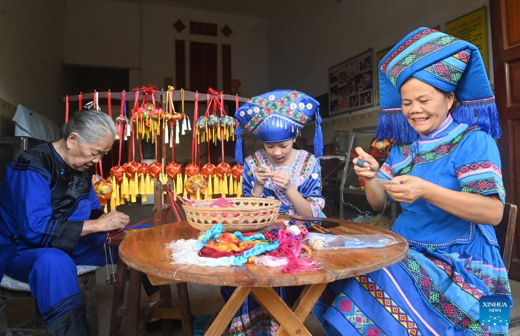 Locals make embroidered balls in Xinjing Township of Jingxi City, south China's Guangxi Zhuang Autonomous Region, Aug. 27, 2024. Embroidered balls from Jingxi are well received nationwide due to their exquisite design and craftsmanship, which are uaually stuffed with spices or herbal medicines. (Photo: Xinhua)