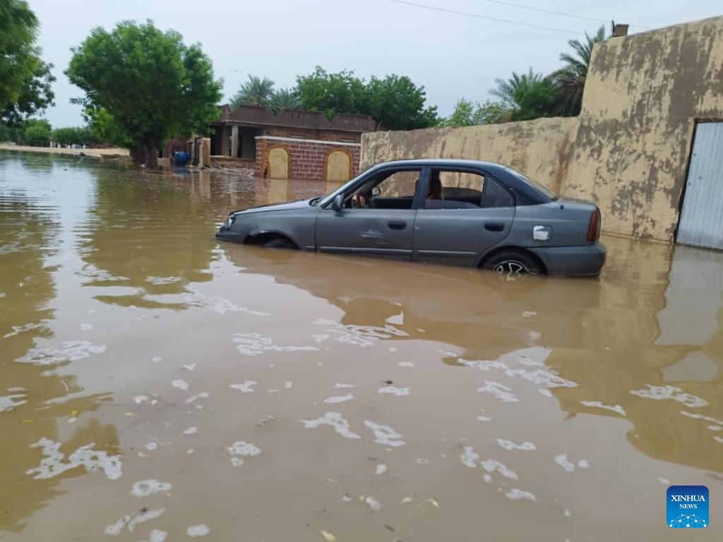 This photo taken with a mobile phone shows a car soaked in floodwater in Dongola, Sudan, Aug. 27, 2024. The death toll from heavy rains hitting so far 10 states in Sudan has reached 138, the country's Health Ministry said Tuesday. (Photo: Xinhua)