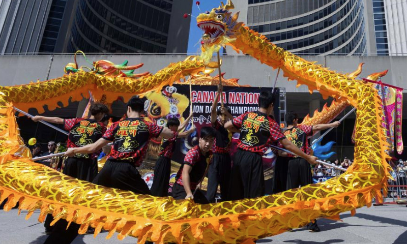 Artists perform dragon dance during the 2024 Toronto Dragon Festival at Nathan Phillips Square in Toronto, Canada, Sept. 1, 2024. (Photo by Zou Zheng/Xinhua)