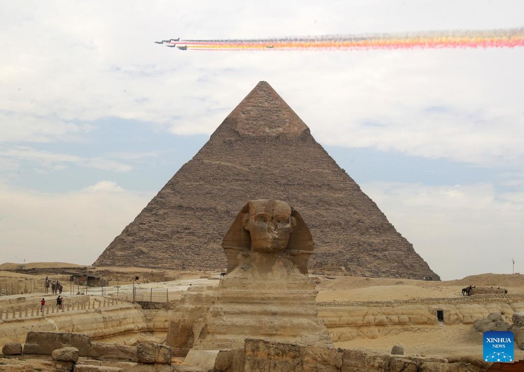 J-10 fighter jets from China's Bayi Aerobatic Team fly over the Giza Pyramids scenic spot in Giza, Egypt, Aug. 28, 2024. The flight formation is in Egypt for an air show, scheduled from Sept. 3 to 5. (Photo: Xinhua)