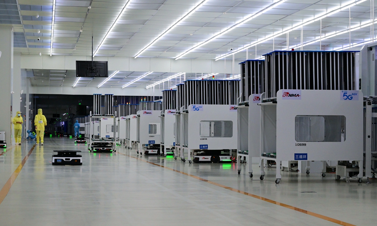 Robots carry solar modules inside a photovoltaic plant in Jinhua, East China's Zhejiang Province on August 30, 2024. In the first seven months of this year, solar power's cumulative power generation capacity increased by 49.8 percent to 740 million kilowatts in the country, data showed. Photo: VCG