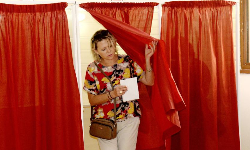 A woman prepares to cast her ballot at a polling station in Baku, Azerbaijan, Sept. 1, 2024. Azerbaijan's snap parliamentary elections began early Sunday. (Photo by Tofik Babayev/Xinhua)