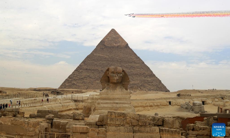 J-10 fighter jets from China's Bayi Aerobatic Team fly over the Giza Pyramids scenic spot in Giza, Egypt, Aug. 28, 2024. The flight formation is in Egypt for an air show, scheduled from Sept. 3 to 5. (Photo: Xinhua)