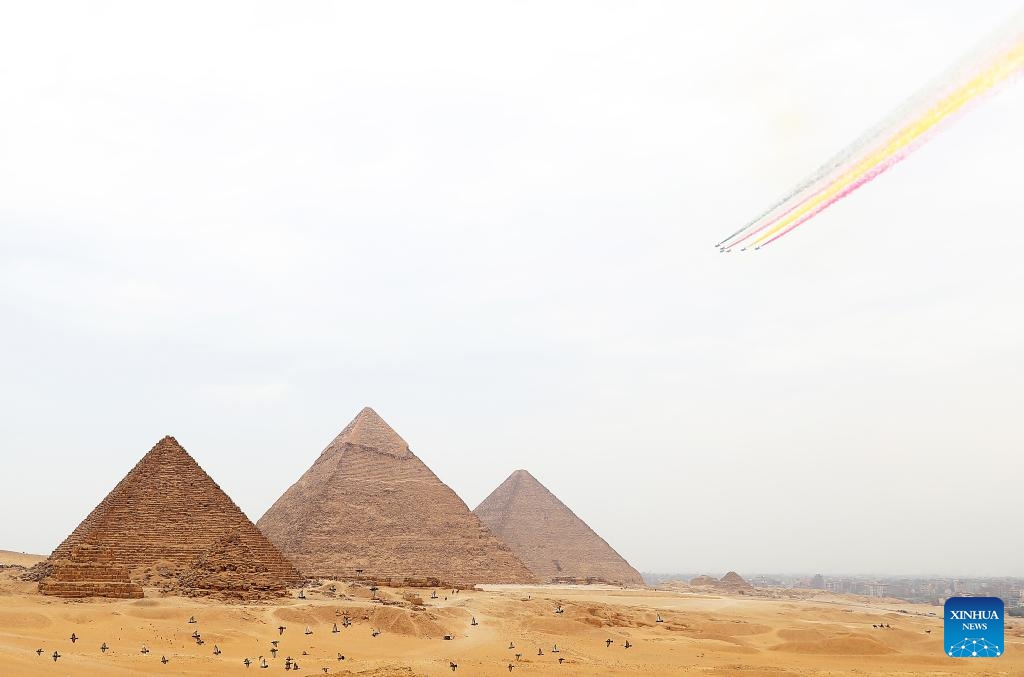 J-10 fighter jets from China's Bayi Aerobatic Team fly over the Giza Pyramids scenic spot in Giza, Egypt, Aug. 28, 2024. The flight formation is in Egypt for an air show, scheduled from Sept. 3 to 5. (Photo: Xinhua)