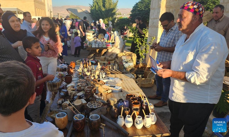 Vendors and visitors are pictured at an agricultural fair in Baalbek, Lebanon, on Aug. 30, 2024. Lebanese agricultural products and handicrafts, as well as many artistic activities, were displayed here on Saturday. Photo: Xinhua