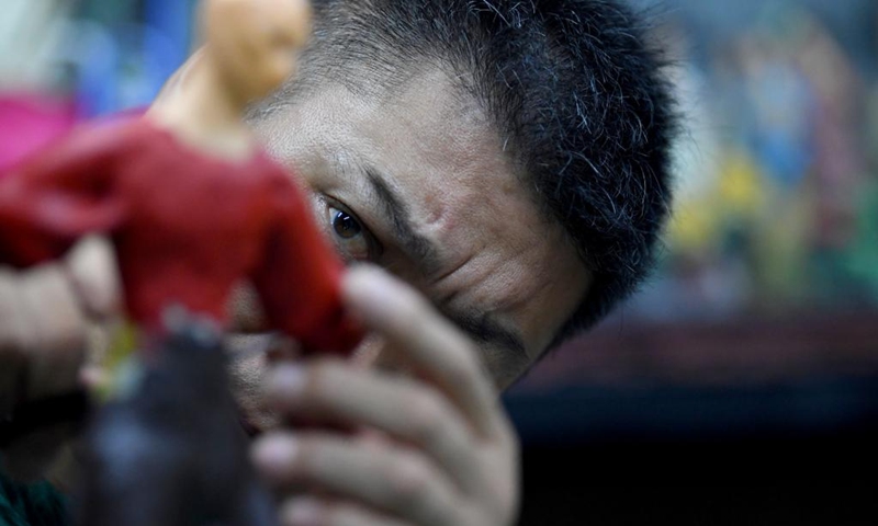 Song Zhanke makes a dough sculpture of Chinese mythological figure the Monkey King or Sun Wukong, at his studio in Luoyang, central China's Henan Province, Aug. 27, 2024. The dough handicraft takes wheat and glutinous rice flour as its main building materials, which are mixed with oil, salt, vinegar and other ingredients. Using hands and simple tools, an artist kneads and pinches the dough to turn it into intricate and lifelike figures.

Song Zhanke, 46, is an inheritor of Song's dough sculpture, a renowned dough handicraft in Luoyang. Having lived by the profession for 20 plus years, the inheritor believes that the figure's body-head proportion, gestures, and facial expressions hold the key to this craft. It is not only the practice of a skill, but also a pursuit and perception of beauty, Song said.

Song hopes that the craft will be better received among younger people and passed down to the future generations. Photo: Xinhua