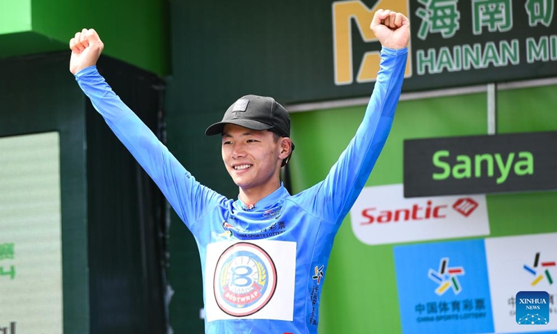 China's Wang Kuicheng of Bodywrap Men's Cycling Team celebrates in the blue jersey after Stage 5 of the 15th Tour of Hainan Island cycling race from Changjiang to Sanya, south China's Hainan Province, Aug. 31, 2024. Photo: Xinhua