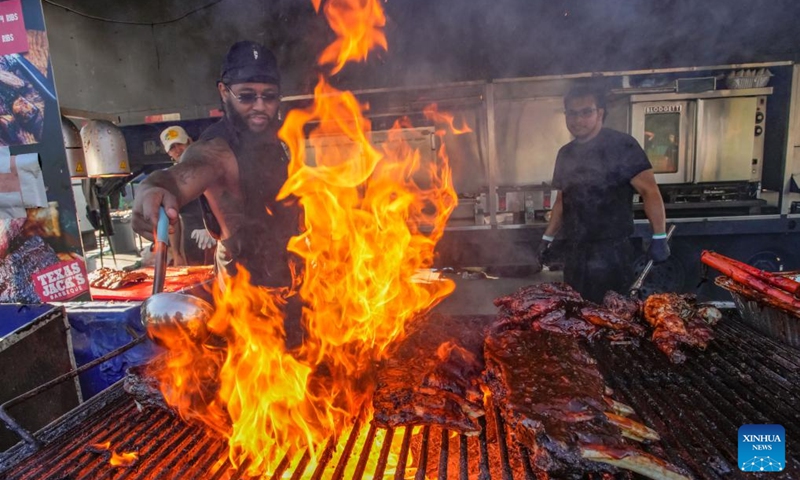 A vendor grills ribs at the Halal Ribfest event in Surrey, British Columbia, Canada, Aug. 30, 2024. The event runs from Aug. 30 to Sept. 1. Photo: Xinhua