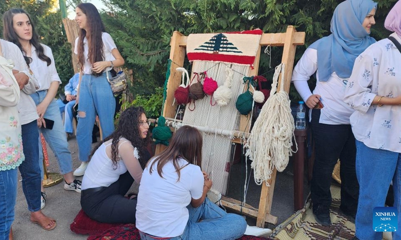 Vendors and visitors are pictured at an agricultural fair in Baalbek, Lebanon, on Aug. 30, 2024. Lebanese agricultural products and handicrafts, as well as many artistic activities, were displayed here on Saturday. Photo: Xinhua