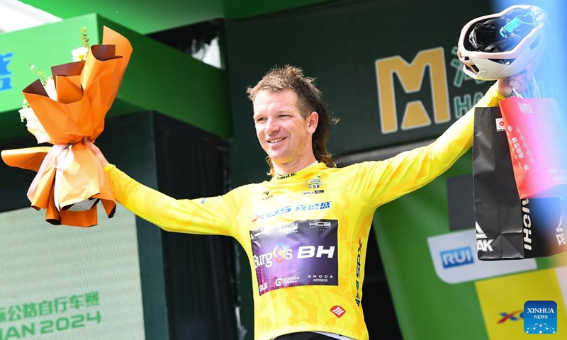 New Zealand's Aaron Murray Gate of Burgos-BH celebrates in the yellow jersey after Stage 5 of the 15th Tour of Hainan Island cycling race from Changjiang to Sanya, south China's Hainan Province, Aug. 31, 2024. Photo: Xinhua