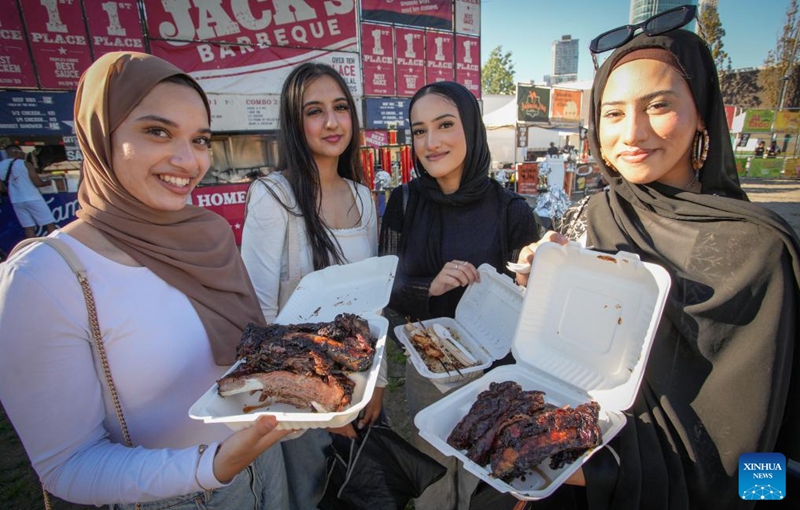 People present grilled food at the Halal Ribfest event in Surrey, British Columbia, Canada, Aug. 30, 2024. The event runs from Aug. 30 to Sept. 1. Photo: Xinhua