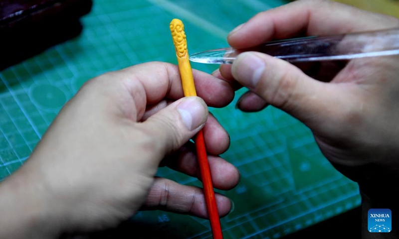 Song Zhanke makes a dough miniature of Jingubang, the weapon of Chinese mythological figure the Monkey King or Sun Wukong, at his studio in Luoyang, central China's Henan Province, Aug. 27, 2024. The dough handicraft takes wheat and glutinous rice flour as its main building materials, which are mixed with oil, salt, vinegar and other ingredients. Using hands and simple tools, an artist kneads and pinches the dough to turn it into intricate and lifelike figures.

Song Zhanke, 46, is an inheritor of Song's dough sculpture, a renowned dough handicraft in Luoyang. Having lived by the profession for 20 plus years, the inheritor believes that the figure's body-head proportion, gestures, and facial expressions hold the key to this craft. It is not only the practice of a skill, but also a pursuit and perception of beauty, Song said.

Song hopes that the craft will be better received among younger people and passed down to the future generations.  Photo: Xinhua