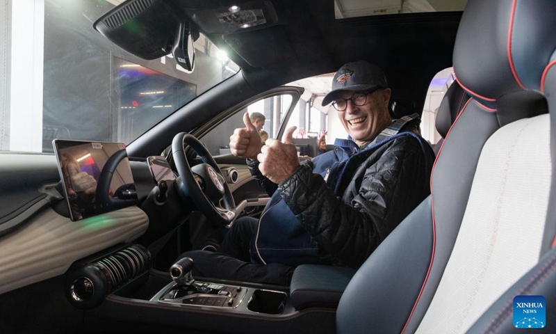 A visitor thumbs up while trying an electric vehicle of BYD from China during the Festival of Motoring in Johannesburg, South Africa, Aug. 30, 2024. This event is held here from Aug. 30 to Sept. 1. Photo: Xinhua