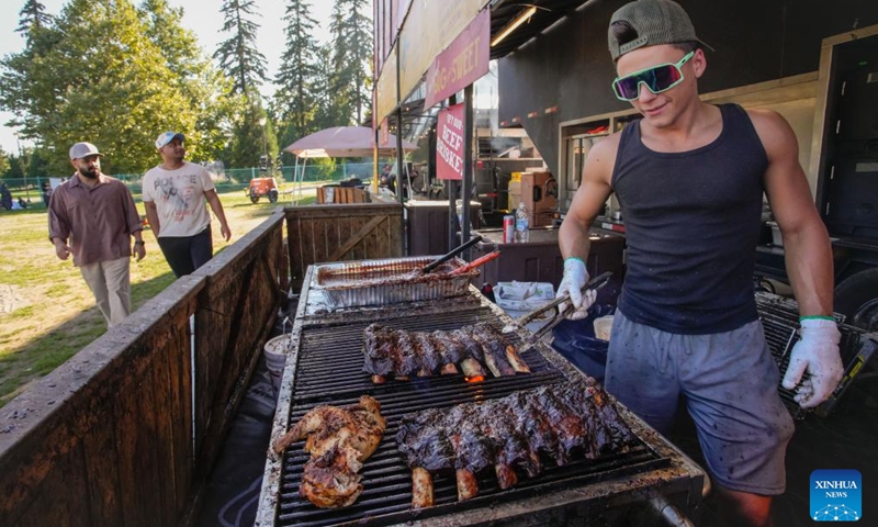 A vendor grills ribs at the Halal Ribfest event in Surrey, British Columbia, Canada, Aug. 30, 2024. The event runs from Aug. 30 to Sept. 1. Photo: Xinhua