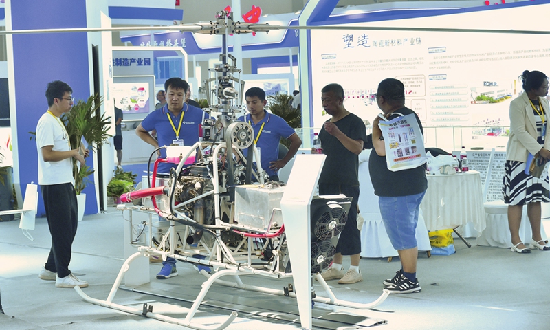 Participants and exhibitors examine an agricultural drone at the 22nd China International Equipment Manufacturing Exposition in Shenyang, Northeast China's Liaoning Province on September 1, 2024. The expo drew 946 exhibitors with 821 domestic firms and 125 overseas participants. As of the end of 2023, the number of plant protection drones in China exceeded 200,000. 
Photo: VCG
