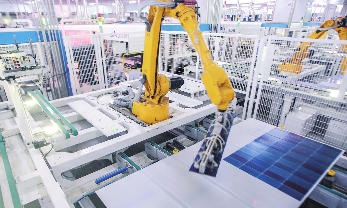 Robotic arms work on the automated production line of a new-energy company in Yangzhou, East China's Jiangsu Province on September 2, 2024. Photovoltaic firms in the city have increased investment in innovation, and the city has formed a photovoltaic industry chain, making those products welcome at home and abroad. Photo: VCG