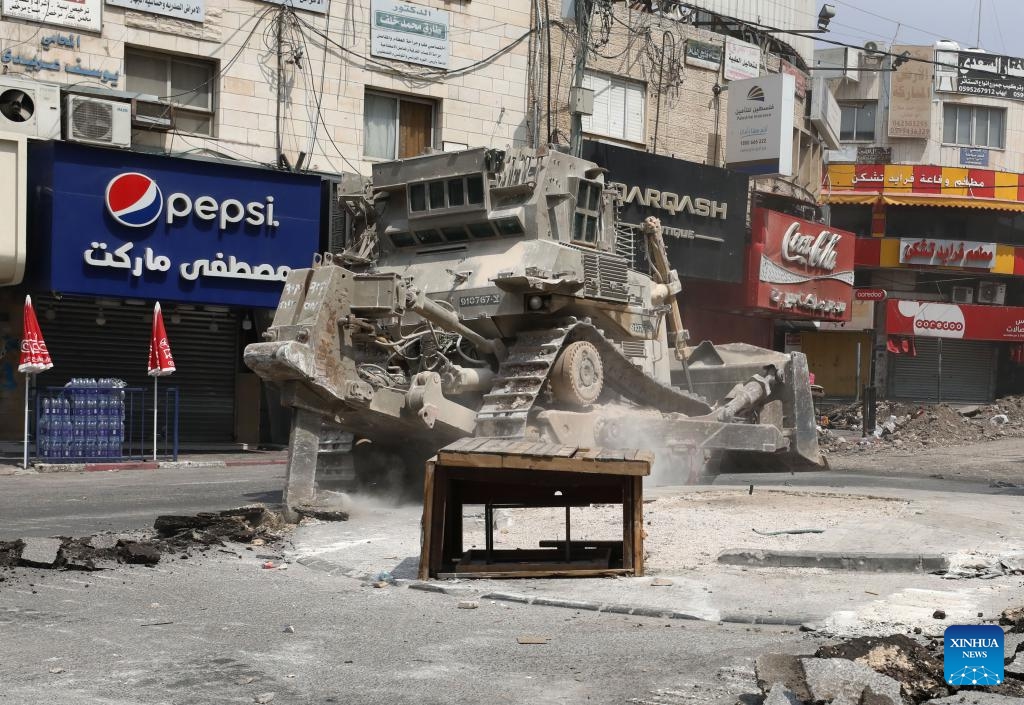 An Israeli bulldozer destroys a road in the northern West Bank city of Jenin, on Sept. 2, 2024. The Israeli forces continued operation on Jenin and its camp for the sixth consecutive day on Monday, the Palestinian official news agency WAFA reported. WAFA said that the operation has caused widespread destruction of infrastructure, including water and electricity networks, as well as people's property. (Photo: Xinhua)