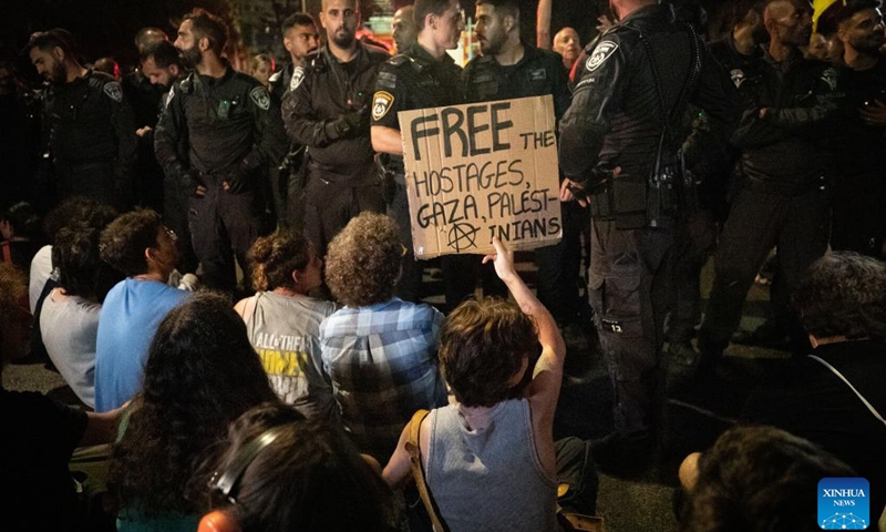 People confront police during a protest calling for an immediate ceasefire and the release of Israeli hostages held in Gaza, in Jerusalem, on Sept. 2, 2024. Rallies and a partial strike continued across Israel for the second day in a row on Monday, as the discovery of the bodies of six hostages in a Gaza tunnel over the weekend has intensified national outage. (Photo: Xinhua)