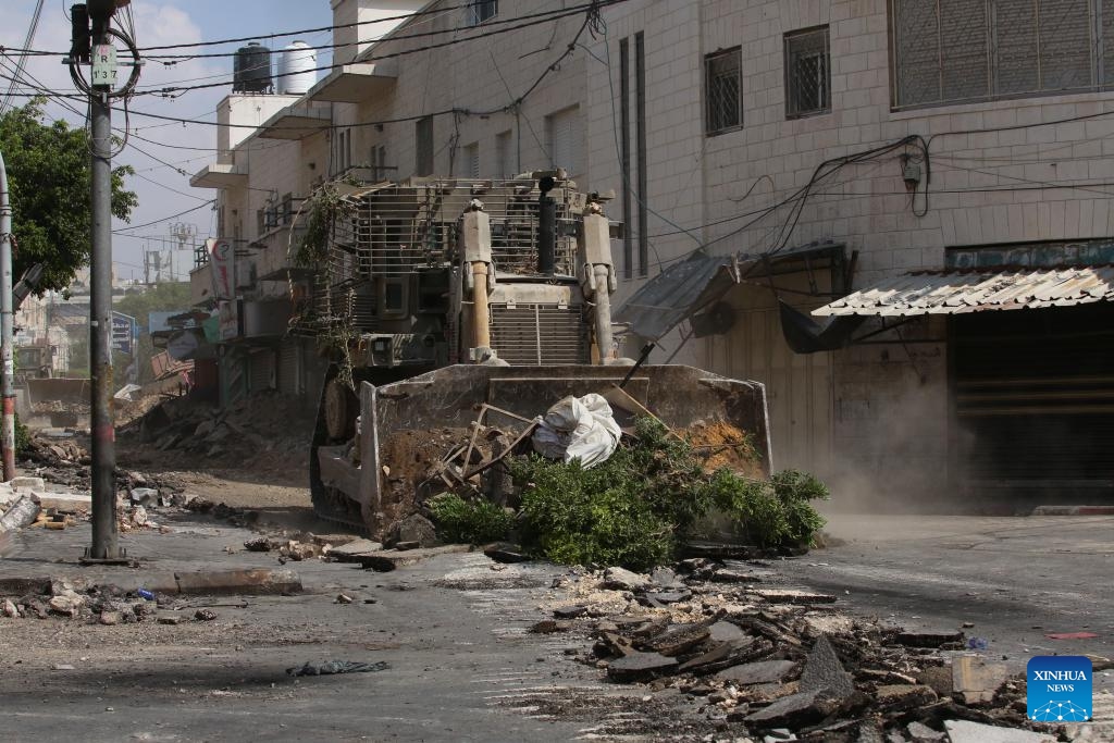 An Israeli bulldozer destroys a road in the northern West Bank city of Jenin, on Sept. 2, 2024. The Israeli forces continued operation on Jenin and its camp for the sixth consecutive day on Monday, the Palestinian official news agency WAFA reported. WAFA said that the operation has caused widespread destruction of infrastructure, including water and electricity networks, as well as people's property. (Photo: Xinhua)