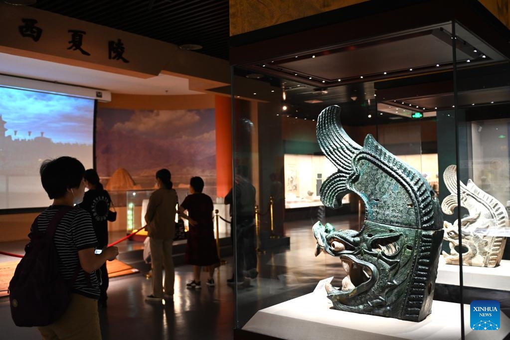 Tourists look at cultural relics of Xixia Dynasty (1038-1227), in Ningxia Museum in Yinchuan, capital of northwest China's Ningxia Hui Autonomous Region, Sept. 1, 2024. As one of China's national first-grade museums, Ningxia Museum showcases the rich culture and history of Ningxia. (Photo: Xinhua)