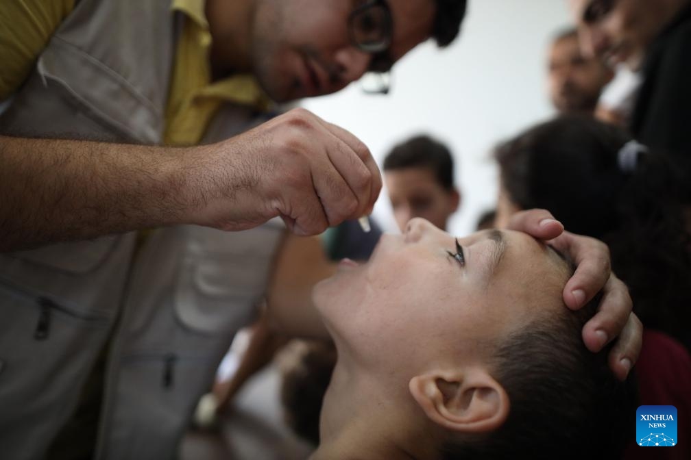 A child receives a dose of the polio vaccine in the Al-Maghazi refugee camp, central Gaza Strip, on Sept. 2, 2024. Initial reporting shows over 86,000 children in the central Gaza Strip received a polio vaccine on Sunday, the first day of the polio campaign in the coastal enclave, Director-General of the World Health Organization Tedros Adhanom Ghebreyesus said on social media platform X on Monday. (Photo: Xinhua)