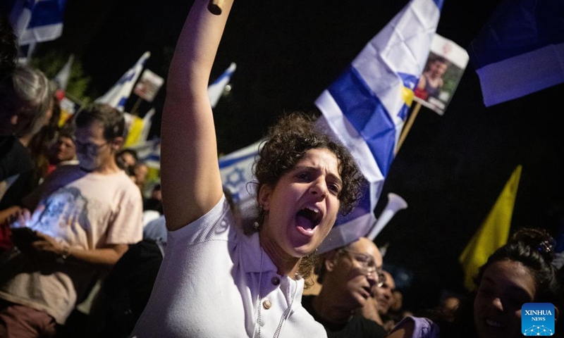 People attend a protest calling for an immediate ceasefire and the release of Israeli hostages held in Gaza, in Jerusalem, on Sept. 2, 2024. Rallies and a partial strike continued across Israel for the second day in a row on Monday, as the discovery of the bodies of six hostages in a Gaza tunnel over the weekend has intensified national outage. (Photo: Xinhua)