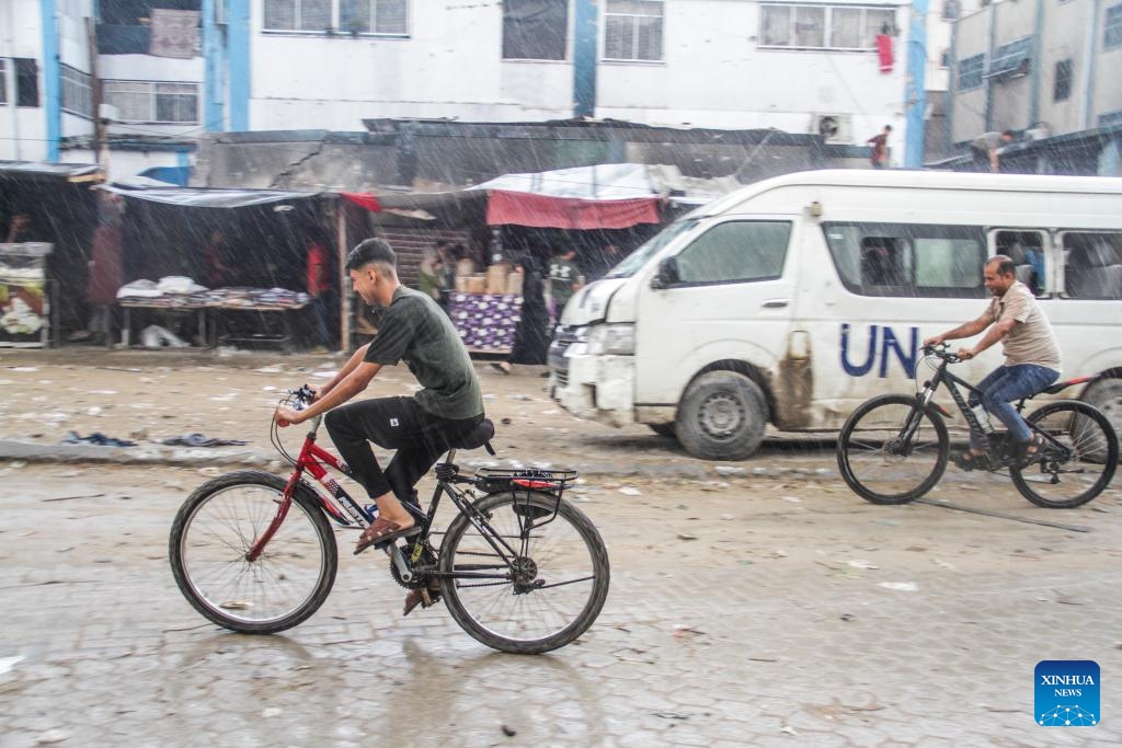 People ride in the rain in Jabalia refugee camp in the northern Gaza Strip, Sept. 1, 2024. (Photo: Xinhua)