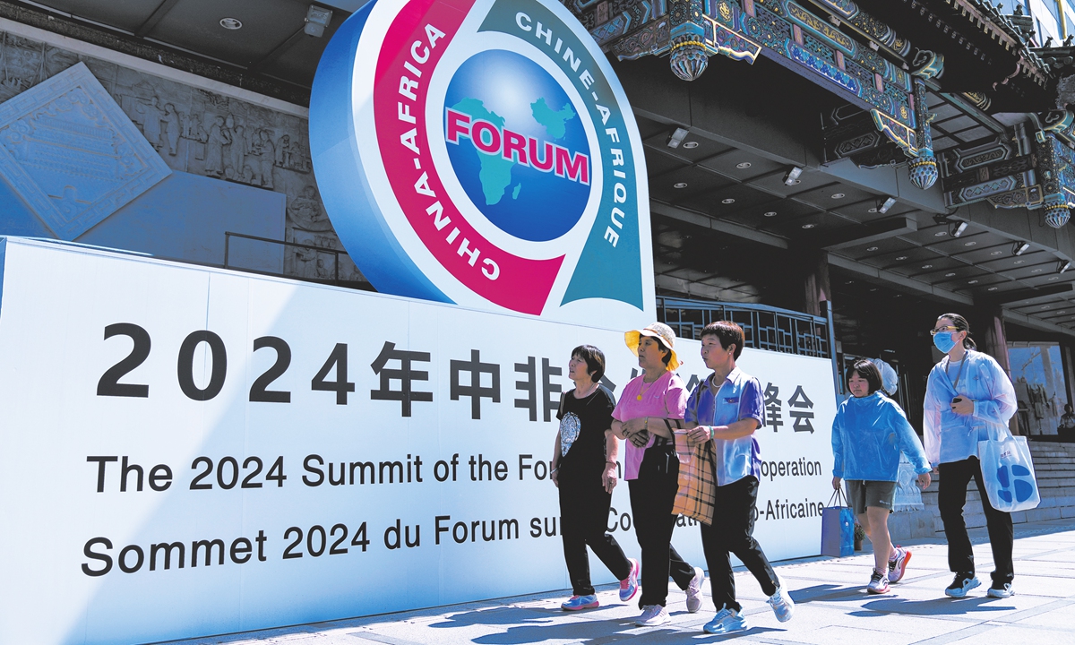 People walk past the display board of FOCAC outside a trade market complex in Beijing,<strong></strong> on September 2, 2024.  Photo: VCG