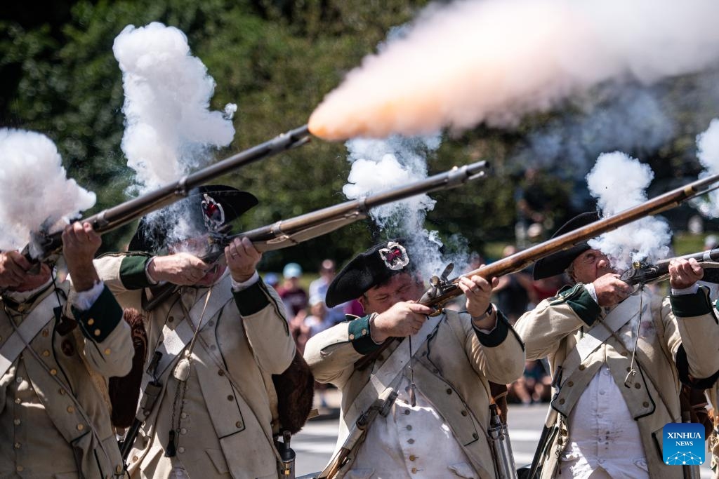 People participate in Labor Day parade in Marlborough, U.S. Global Times