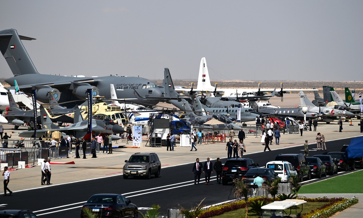 Visitors walk in front of planes during the Egypt International Air Show, at El Alamein International Airport, Egypt, on September 4, 2024. Egypt International Air Show 2024 takes place from September 3 to 5. Photo: IC