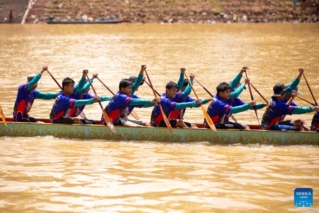 People participate in an annual dragon boat racing festival in Luang Prabang, Laos, Sept. 2, 2024. (Photo: Xinhua)