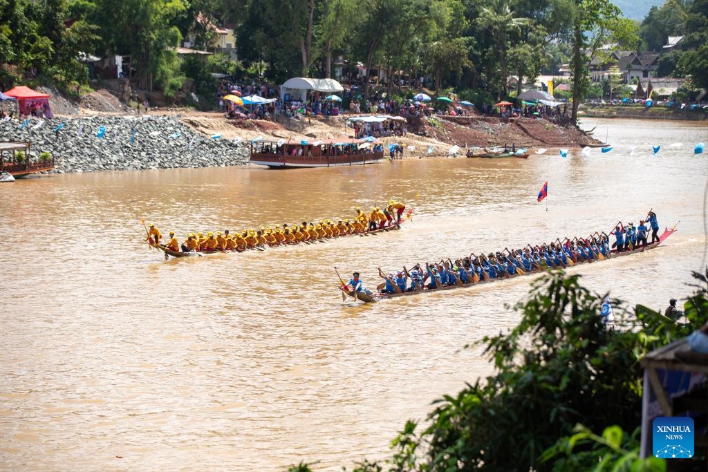 People participate in an annual dragon boat racing festival in Luang Prabang, Laos, Sept. 2, 2024. (Photo: Xinhua)