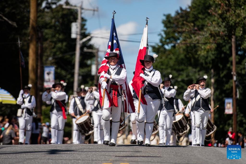 People participate in Labor Day parade in Marlborough, U.S. Global Times