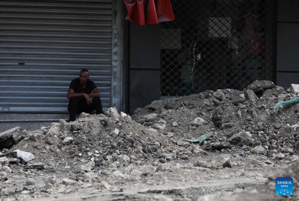 A man sits by the side of a damaged street after an Israeli raid in the West Bank city of Jenin, Sept. 4, 2024. Israel's military operations across the West Bank starting from Aug. 28 have caused great damages and casualties. (Photo: Xinhua)