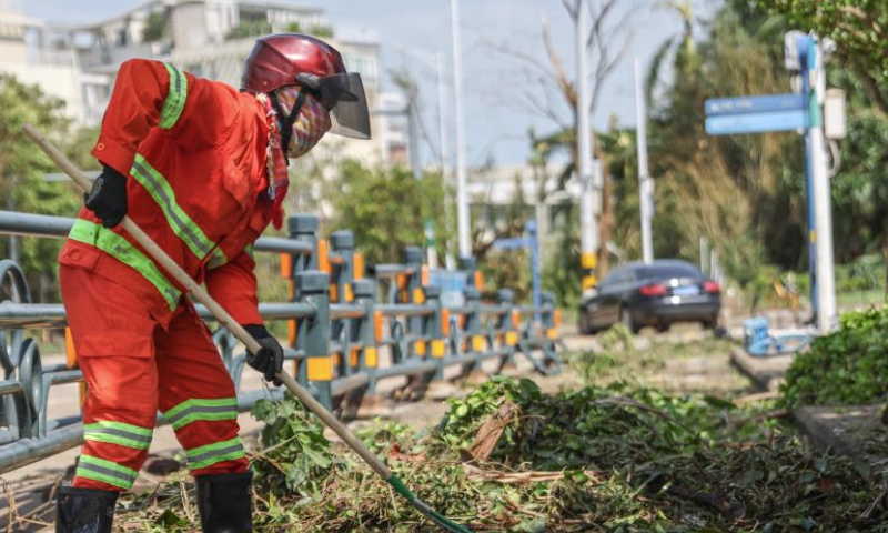 A sanitation worker cleans a street in Haikou, south China's Hainan Province, Sept. 8, 2024. Yagi, the 11th typhoon of the year, made landfall in Hainan on Friday afternoon. As winds and rainfall subsided, Hainan downgraded its typhoon alert and initiated swift recovery operations across the province. (Xinhua/Zhang Liyun)