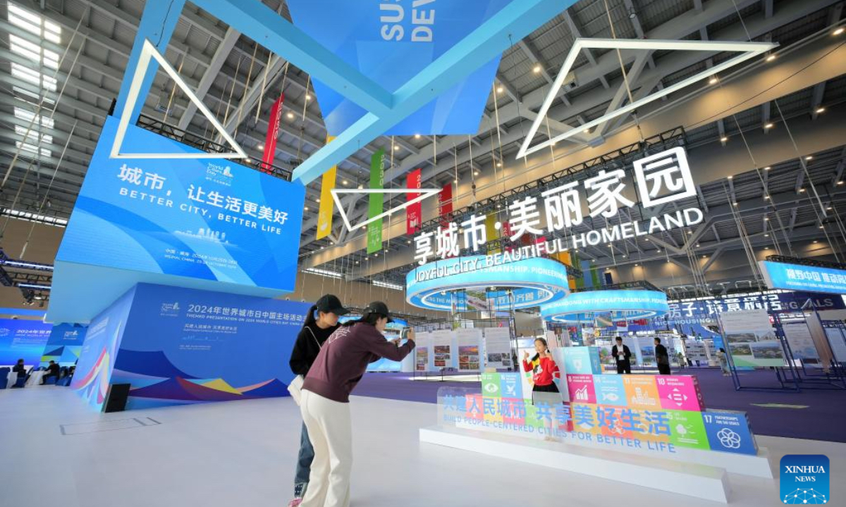 People visit an exhibition of the 2024 World Cities Day China Observance in Weihai, east China's Shandong Province, Oct. 26, 2024. More than 2000 delegates from over 30 countries and regions attended the event. (Photo: Xinhua)