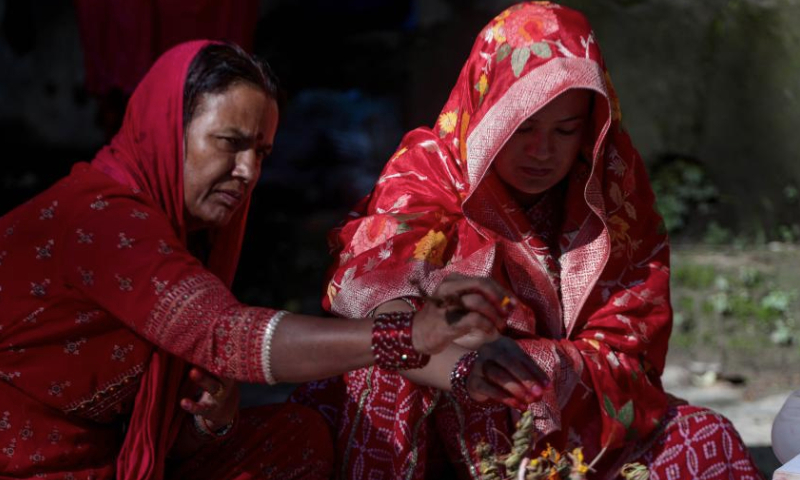 Hindu women perform a ritual in the Bagmati River during Rishi Panchami festival in Kathmandu, Nepal, Sept. 8, 2024. Rishi Panchami festival marks the end of the three-day Teej festival when women worship Sapta Rishi (Seven Saints) and pray for health for their husband while unmarried women wish for handsome husband and happy conjugal lives. (Photo by Sulav Shrestha/Xinhua)