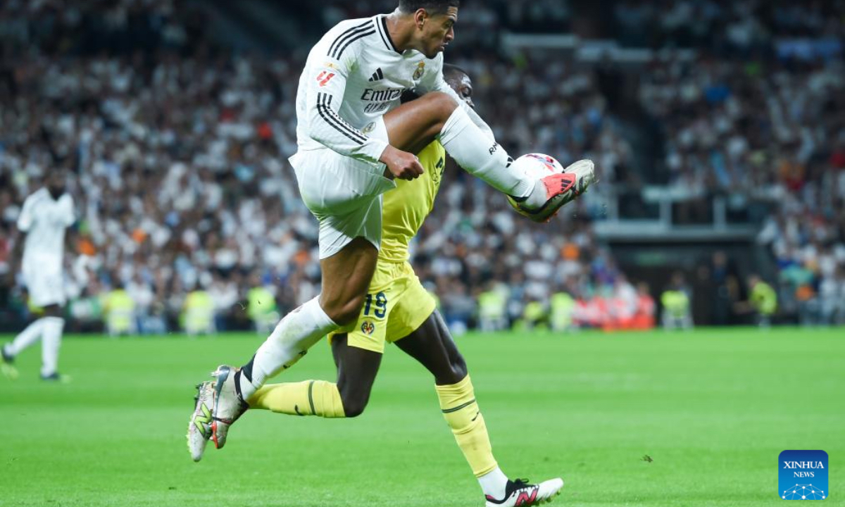 Jude Bellingham of Real Madrid vies with Nicolas Pepe of Villarreal during the La Liga football match between Real Madrid and Villarreal in Madrid, Spain, on Oct. 5, 2024. (Photo: Xinhua)