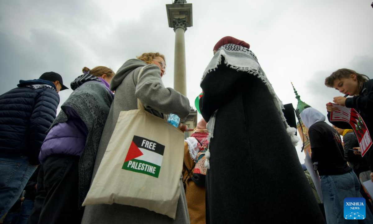 People participate in a rally in support of Palestine near the Castle Square in Warsaw, Poland on Oct. 5, 2024. (Photo: Xinhua)