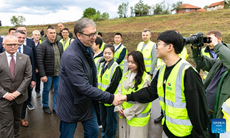 Serbian President Aleksandar Vucic shakes hands with constructors of a new bypass road in Gornji Milanovac, Serbia, Oct. 4, 2024. Serbian President Aleksandar Vucic on Friday inaugurated a new bypass road around the municipality of Gornji Milanovac, constructed by a Chinese company as part of Serbia's broader infrastructure development initiatives. (Photo by Wang Wei/Xinhua)