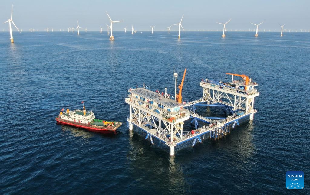 An aerial drone photo taken on Sept. 2, 2024 shows China General Nuclear Power Corporation (CGN)'s Fuxi No. 1 wind power-fishery integrated project in Shanwei, south China's Guangdong Province. Using green energy as its power supply, the marine ranch project started its operation in Shanwei on Sept. 4. It is expected to produce 900 tonnes of high-quality marine fish annually. (Photo: Xinhua)