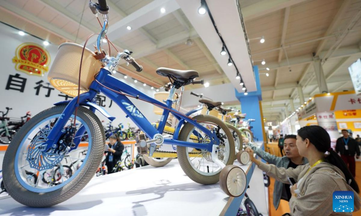 Merchants visit the 18th International Bicycles, Baby Strollers and Toys Fair in Pingxiang County, north China's Hebei Province, Oct. 26, 2024. The fair opened here on Saturday, with more than 3,000 booths and attracting merchants from over 80 countries and regions. Pingxiang of Hebei Province is renowned for its industry of bicycles, baby strollers and toys. (Photo: Xinhua)