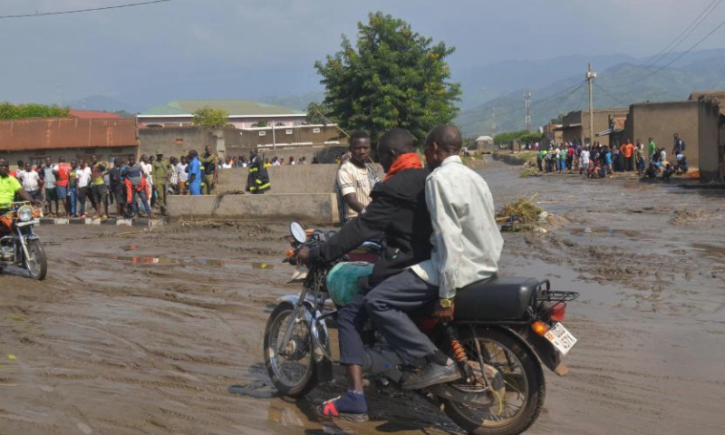 Motorcycle taxis pass through a flooded street in Kasese, western Uganda, Sept. 8, 2024. Three people were killed in flash floods triggered by heavy downpours Saturday in the western Ugandan district of Kasese, according to a humanitarian relief agency. (Photo by Gilbert Muhanguzi/Xinhua)