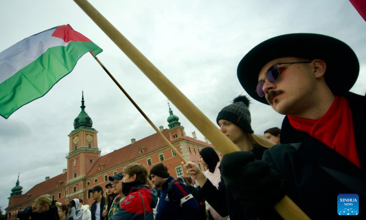 People participate in a rally in support of Palestine near the Castle Square in Warsaw, Poland on Oct. 5, 2024. (Photo: Xinhua)