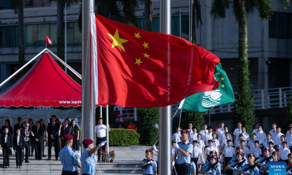 A flag-raising ceremony marking the 75th anniversary of the founding of the People's Republic of China is held in Macao, south China, Oct 1, 2024. Photo:Xinhua