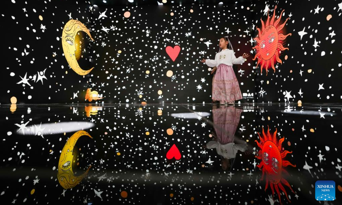 A child immerses herself in a digital art exhibition during the 2024 China International Fair for Trade in Services (CIFTIS) in the Cultural & Tourism Service thematic exhibition area at the Shougang Park in Beijing, capital of China, Sep 15, 2024. Photo:Xinhua